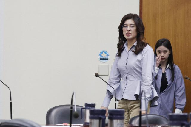 KMT Chairwoman Cheng Li-wun (C) walks into a conference room for a news conference about her trip to the United States, in Taipei on June 17, 2026. (Photo by I-HWA CHENG / AFP)