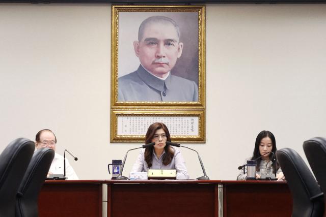 KMT Chairwoman Cheng Li-wun (C) holds a news conference about her trip to the United States, in Taipei on June 17, 2026. (Photo by I-HWA CHENG / AFP)