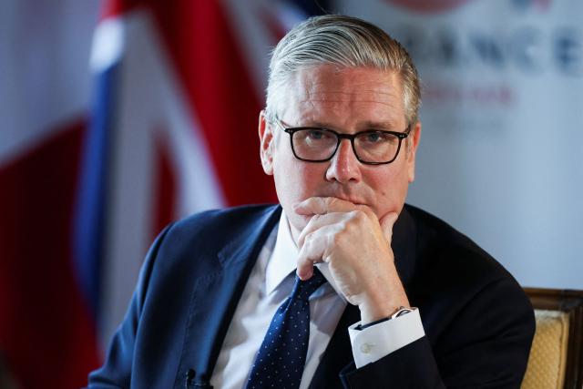 Britain's Prime Minister Keir Starmer looks on as he speaks to the members of the media on the sidelines of the G7 summit, in Thonon-les-Bains, on June 17, 2026. A G7 summit is set to take place June 15 to 17 in the French town of Evian-les-Bains near Switzerland and it will be attended by country leaders as well as the EU's foreign policy chief and ministers from Brazil, Canada, the United Arab Emirates and Turkey. (Photo by Isabel Infantes / POOL / AFP)