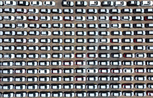 Chinese-made MG cars are seen on a dock before being loaded onto a ship for export, at the port in Lianyungang, in China’s eastern Jiangsu province on June 17, 2026. (Photo by CN-STR / AFP) / China OUT