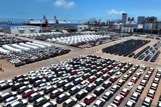 Chinese-made MG cars (foreground) are seen on a dock before being loaded onto a ship for export, at the port in Lianyungang, in China’s eastern Jiangsu province on June 17, 2026. (Photo by CN-STR / AFP) / China OUT