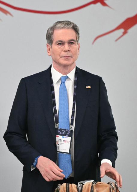 US Secretary of Treasury Scott Bessent reacts as he arrives ahead of a morning work meeting to “revive balanced, inclusive, and sustainable economic growth for the benefit of all” in the presence of the G7 countries, partner countries, the International Monetary Fund, and the OECD, as part of the G7 summit, in Evian, eastern France, on June 17, 2026. G7 leaders will discuss on June 17, 2026, the security risks posed by AI and social media on the last day of a summit dominated by US the President, before host French President  dines with his US counterpart at the Palace of Versailles. The three-day summit of the leaders of Canada, France, Germany, Italy, Japan,B ritain and the United States has focused intensely on the US' deal to end the war with Iran and efforts to pressure Russia into brokering peace with Ukraine. (Photo by Mandel NGAN / AFP)
