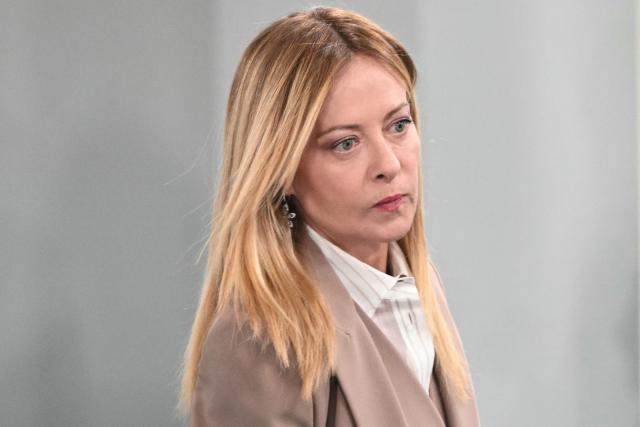 Italy's Prime Minister Giorgia Meloni reacts as she arrives ahead of a morning work meeting to “revive balanced, inclusive, and sustainable economic growth for the benefit of all” in the presence of the G7 countries, partner countries, the International Monetary Fund, and the OECD, as part of the G7 summit, in Evian, eastern France, on June 17, 2026. G7 leaders will discuss on June 17, 2026, the security risks posed by AI and social media on the last day of a summit dominated by US the President, before host French President  dines with his US counterpart at the Palace of Versailles. The three-day summit of the leaders of Canada, France, Germany, Italy, Japan,B ritain and the United States has focused intensely on the US' deal to end the war with Iran and efforts to pressure Russia into brokering peace with Ukraine. (Photo by Mandel NGAN / AFP)