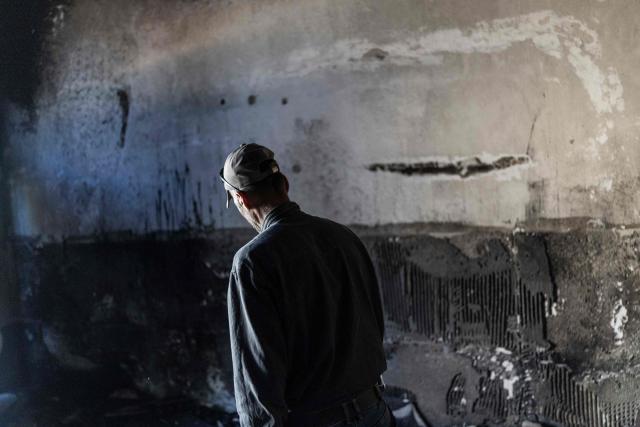 Palestinian men walks past a charred wall as he inspects the damage inside a mosque reportedly burnt by Israeli settlers over night, in the Israeli occupied West Bank village of Jiljlia, just north of the West Bank city of Ramallah on June 17, 2026. Expanding Israeli settlements has been a policy under successive Israeli governments but has accelerated under the current prime minister's coalition, which is backed by far-right allies. More than 500,000 Israelis now live in the West Bank. excluding east Jerusalem, in settlements that are illegal under international law, among some three million Palestinians. (Photo by ilia YEFIMOVICH / AFP) / 