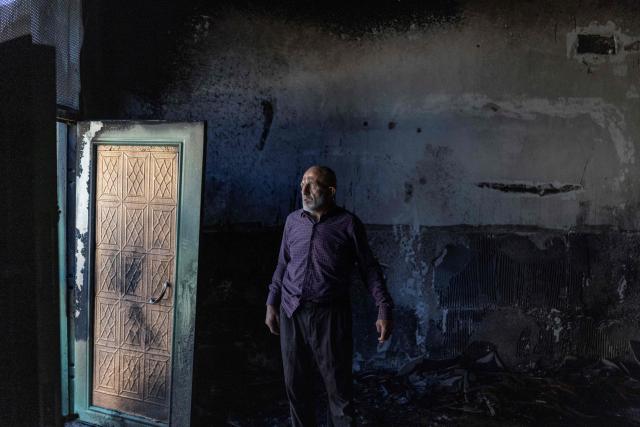 A Palestinian man inspects the damage inside a mosque reportedly burnt by Israeli settlers over night, in the Israeli occupied West Bank village of Jiljlia, just north of the West Bank city of Ramallah on June 17, 2026. Expanding Israeli settlements has been a policy under successive Israeli governments but has accelerated under the current prime minister's coalition, which is backed by far-right allies. More than 500,000 Israelis now live in the West Bank. excluding east Jerusalem, in settlements that are illegal under international law, among some three million Palestinians. (Photo by ilia YEFIMOVICH / AFP) / 