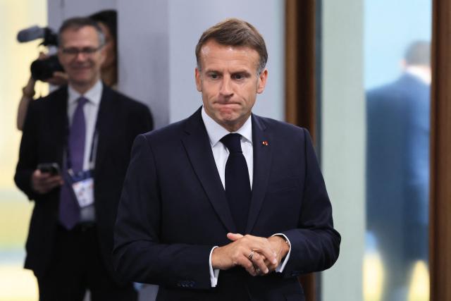 France's President Emmanuel Macron arrives to attend a morning work meeting to “revive balanced, inclusive, and sustainable economic growth for the benefit of all” in the presence of the G7 countries, partner countries, the International Monetary Fund, and the OECD, as part of the G7 summit, in Evian, eastern France, on June 17, 2026. G7 leaders will discuss on June 17, 2026, the security risks posed by AI and social media on the last day of a summit dominated by US the President, before host French President  dines with his US counterpart at the Palace of Versailles. The three-day summit of the leaders of Canada, France, Germany, Italy, Japan,B ritain and the United States has focused intensely on the US' deal to end the war with Iran and efforts to pressure Russia into brokering peace with Ukraine. (Photo by Ludovic MARIN / AFP)