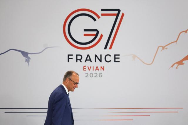Germany’s Chancellor Friedrich Merz arrives to attend a morning work meeting to “revive balanced, inclusive, and sustainable economic growth for the benefit of all” in the presence of the G7 countries, partner countries, the International Monetary Fund, and the OECD, as part of the G7 summit, in Evian, eastern France, on June 17, 2026. G7 leaders will discuss on June 17, 2026, the security risks posed by AI and social media on the last day of a summit dominated by US the President, before host French President  dines with his US counterpart at the Palace of Versailles. The three-day summit of the leaders of Canada, France, Germany, Italy, Japan,B ritain and the United States has focused intensely on the US' deal to end the war with Iran and efforts to pressure Russia into brokering peace with Ukraine. (Photo by Ludovic MARIN / AFP)