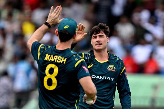 Australia's Matt Renshaw (R) celebrates with captain Mitchell Marsh after taking the wicket of Bangladesh's Saif Hassan during the first Twenty20 (T20) international cricket match between Bangladesh and Australia at the Bir Sreshtho Flight Lieutenant Matiur Rahman Stadium in Chattogram on June 17, 2026. (Photo by AFP)