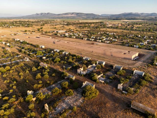 This aerial view shows The Rivesaltes Camp Memorial and The Joffre Camp site at Salses Le Chateau in the Pyrenees-Orientales department in south-western France on June 17, 2026. Bearing painful memories, the museum of the Rivesaltes camp (Pyrйnйes-Orientales) — which over the course of the 20th century housed Spanish refugees, Jews, Roma and Harkis — has unveiled a new permanent exhibition, was inaugurated on May 29, 2026, to defend “historical truth” against the “populisms” that threaten it. (Photo by Jc Milhet / AFP)