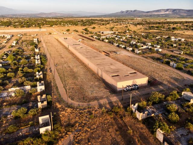 This aerial view shows The Rivesaltes Camp Memorial and The Joffre Camp site at Salses Le Chateau in the Pyrenees-Orientales department in south-western France on June 17, 2026. Bearing painful memories, the museum of the Rivesaltes camp (Pyrйnйes-Orientales) — which over the course of the 20th century housed Spanish refugees, Jews, Roma and Harkis — has unveiled a new permanent exhibition, was inaugurated on May 29, 2026, to defend “historical truth” against the “populisms” that threaten it. (Photo by Jc Milhet / AFP)