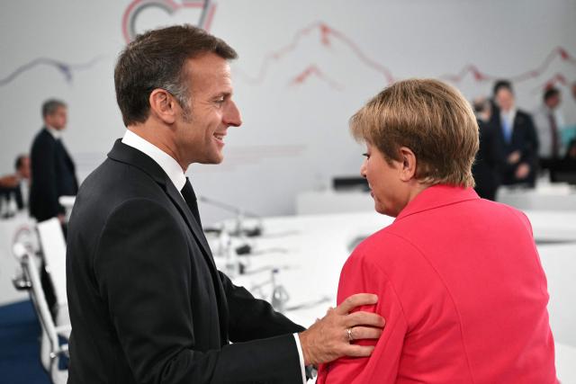 France's President Emmanuel Macron (L) speaks with IMF Managing Director Kristalina Georgieva ahead of a morning work meeting to “revive balanced, inclusive, and sustainable economic growth for the benefit of all” in the presence of the G7 countries, partner countries, the International Monetary Fund, and the OECD, as part of the G7 summit, in Evian, eastern France, on June 17, 2026. G7 leaders will discuss on June 17, 2026, the security risks posed by AI and social media on the last day of a summit dominated by US the President, before host French President  dines with his US counterpart at the Palace of Versailles. The three-day summit of the leaders of Canada, France, Germany, Italy, Japan,B ritain and the United States has focused intensely on the US' deal to end the war with Iran and efforts to pressure Russia into brokering peace with Ukraine. (Photo by Mandel NGAN / POOL / AFP)