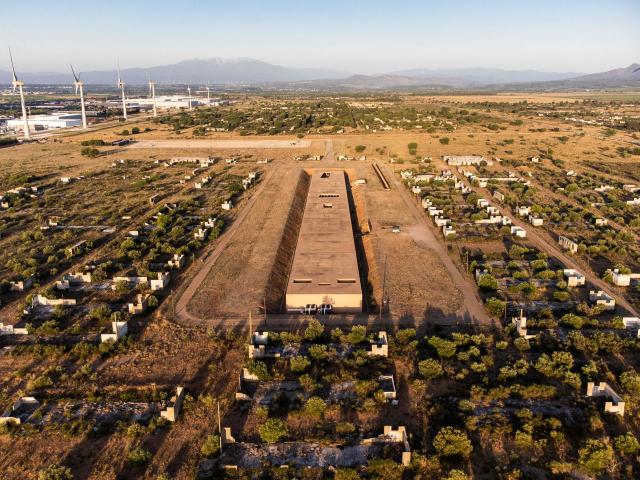 This aerial view shows The Rivesaltes Camp Memorial and The Joffre Camp site at Salses Le Chateau in the Pyrenees-Orientales department in south-western France on June 17, 2026. Bearing painful memories, the museum of the Rivesaltes camp (Pyrйnйes-Orientales) — which over the course of the 20th century housed Spanish refugees, Jews, Roma and Harkis — has unveiled a new permanent exhibition, was inaugurated on May 29, 2026, to defend “historical truth” against the “populisms” that threaten it. (Photo by Jc Milhet / AFP)