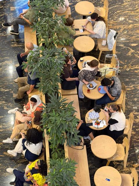 Customers sits at a coffee shop come restaurant as Iranians visit a large shopping mall in the capital Tehran on June 17, 2026. The first tankers carrying Iranian oil exited a US blockade in the Strait of Hormuz, a tracking website said on June 17, two days before Washington and Tehran launch talks on an agreed peace deal still scant on details -- including Iran's nuclear programme and the lifting of sanctions. (Photo by ATTA KENARE / AFP) / 
