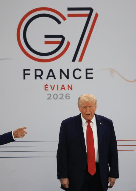 US President Donald Trump arrives to attend a morning work meeting to “revive balanced, inclusive, and sustainable economic growth for the benefit of all” in the presence of the G7 countries, partner countries, the International Monetary Fund, and the OECD, as part of the G7 summit, in Evian, eastern France, on June 17, 2026. G7 leaders will discuss on June 17, 2026, the security risks posed by AI and social media on the last day of a summit dominated by US the President, before host French President  dines with his US counterpart at the Palace of Versailles. The three-day summit of the leaders of Canada, France, Germany, Italy, Japan,B ritain and the United States has focused intensely on the US' deal to end the war with Iran and efforts to pressure Russia into brokering peace with Ukraine. (Photo by Ludovic MARIN / AFP)