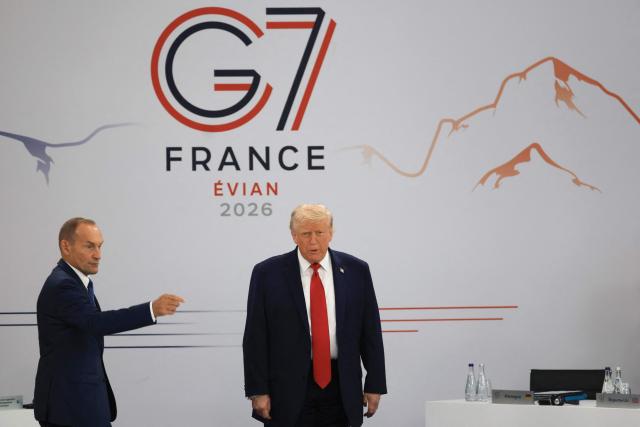 US President Donald Trump arrives to attend a morning work meeting to “revive balanced, inclusive, and sustainable economic growth for the benefit of all” in the presence of the G7 countries, partner countries, the International Monetary Fund, and the OECD, as part of the G7 summit, in Evian, eastern France, on June 17, 2026. G7 leaders will discuss on June 17, 2026, the security risks posed by AI and social media on the last day of a summit dominated by US the President, before host French President  dines with his US counterpart at the Palace of Versailles. The three-day summit of the leaders of Canada, France, Germany, Italy, Japan,B ritain and the United States has focused intensely on the US' deal to end the war with Iran and efforts to pressure Russia into brokering peace with Ukraine. (Photo by Ludovic MARIN / AFP)