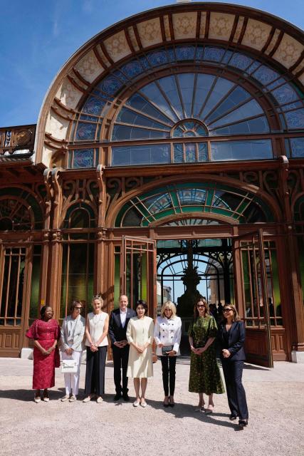 (From L) Kenya's First Lady Rachel Ruto, German Chancellor's wife Charlotte Merz, British economist and Canadian Prime Minister's wife Diana Carney, South Korea's First Lady Kim Hye-kyung, French President's wife Brigitte Macron, British Prime Minister's wife Victoria Starmer and Brazil's First Lady Janja Lula da Silva pose for a photo during the spouses program on the sideline of the G7 summit in Evian, eastern France, on June 17, 2026.  (Photo by Christophe Ena / POOL / AFP)