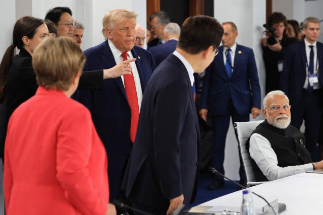(From L) IMF Managing Director Kristalina Georgieva
, US President Donald Trump, South Korea's President Lee Jae-myung and India's Prime Minister Narendra Modi arrive to attend a morning work meeting to “revive balanced, inclusive, and sustainable economic growth for the benefit of all” in the presence of the G7 countries, partner countries, the International Monetary Fund, and the OECD, as part of the G7 summit, in Evian, eastern France, on June 17, 2026.. G7 leaders will discuss on June 17, 2026, the security risks posed by AI and social media on the last day of a summit dominated by US the President, before host French President  dines with his US counterpart at the Palace of Versailles. The three-day summit of the leaders of Canada, France, Germany, Italy, Japan,B ritain and the United States has focused intensely on the US' deal to end the war with Iran and efforts to pressure Russia into brokering peace with Ukraine. (Photo by Ludovic MARIN / AFP)