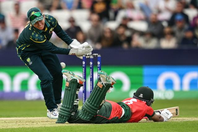 Bangladesh's Sobhana Mostary (R) dives back to avoid being run out during the ICC Women's T20 cricket world cup 2026 game between Australia and Bangladesh, at Headingley in Leeds, northern England on June 17, 2026. (Photo by Oli SCARFF / AFP)