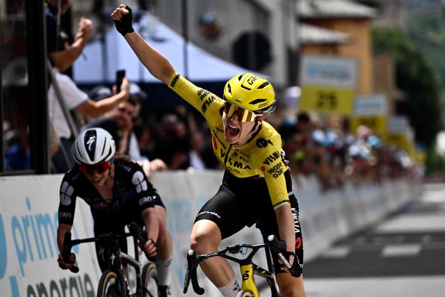 Dutch rider Femke De Vries of team Visma-Lease a Bike celebrates as she crosses the finish line of the first stage of the Women's Tour of Switzerland (Tour de Suisse) cycling race, in Sondrio, Italy, on June 17, 2026. (Photo by Marco BERTORELLO / AFP)
