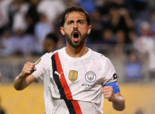 (FILES) Manchester City's Portuguese midfielder #20 Bernardo Silva celebrates after scoring the opening goal during the FIFA Club World Cup 2025 round of 16 football match between England's Manchester City and Saudi's Al-Hilal at the Camping World stadium in Orlando on June 30, 2025. Real Madrid announced on June 17, 2026 the signing of Portuguese international Bernardo Silva for the next two seasons. (Photo by Chandan Khanna / AFP)