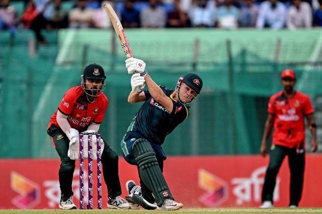 Australia's Cooper Connolly (C) plays a shot during the first Twenty20 (T20) international cricket match between Bangladesh and Australia at the Bir Sreshtho Flight Lieutenant Matiur Rahman Stadium in Chattogram on June 17, 2026. (Photo by AFP)