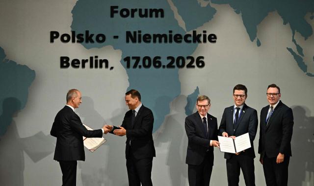 German Foreign Minister Johann Wadephul (3rd R) and Polish Foreign Minister Radoslaw Sikorski (2nd L) pose with laureates of the German-Polish Prize during the German-Polish Forum at the Foreign Ministry in Berlin on June 17, 2026. Key elements of this year's forum include the presentation of the German-Polish Prize, the return of several cultural artifacts by Germany to Polands Minister of Culture and working groups to discuss topics such as Europe, security, culture, youth, history, the economy, and language. (Photo by RALF HIRSCHBERGER / AFP)