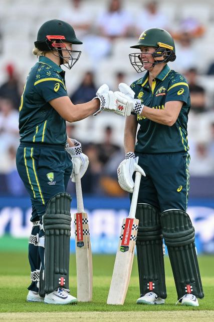 Australia's Georgia Voll (L) and Australia's Beth Mooney (R) celebrate between balls during the ICC Women's T20 cricket world cup 2026 game between Australia and Bangladesh, at Headingley in Leeds, northern England on June 17, 2026. (Photo by Oli SCARFF / AFP)