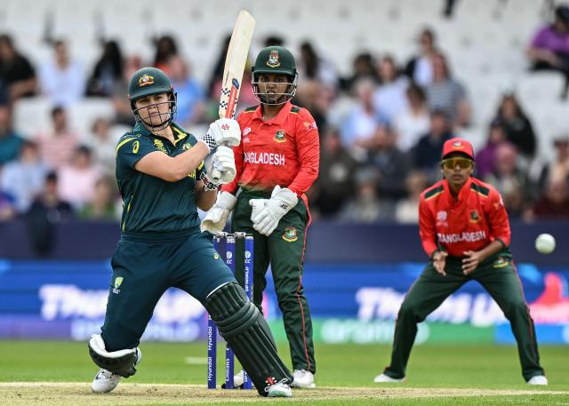TOPSHOT - Australia's Georgia Voll (L) plays a shot during the ICC Women's T20 cricket world cup 2026 game between Australia and Bangladesh, at Headingley in Leeds, northern England on June 17, 2026. (Photo by Oli SCARFF / AFP)