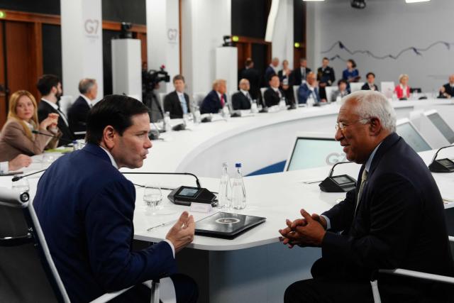 US Secretary of State Marco Rubio (L) talks to European Council President Antonio Costa during a working lunch meeting of G7 members, partner countries, and artificial intelligence business leaders as part of the G7 summit, in Evian, eastern France, on June 17, 2026. A G7 summit is set to take place June 15 to 17 in the French town of Evian-les-Bains near Switzerland and it will be attended by country leaders as well as the EU's foreign policy chief and ministers from Brazil, Canada, the United Arab Emirates and Turkey. (Photo by Julia Demaree Nikhinson / POOL / AFP)