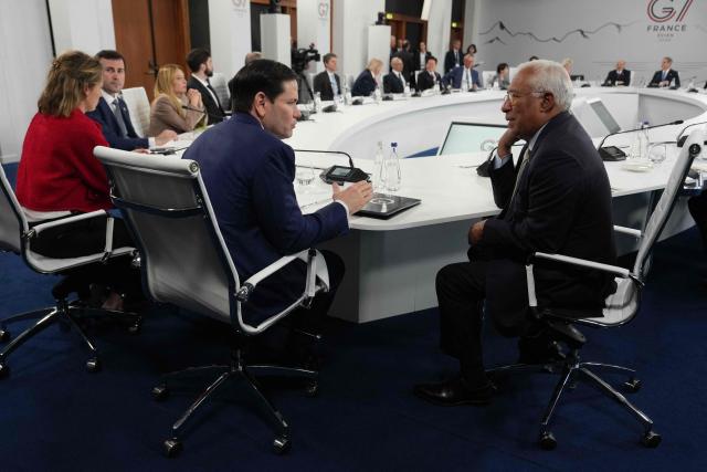 US Secretary of State Marco Rubio (L) talks to European Council President Antonio Costa during a working lunch meeting of G7 members, partner countries, and artificial intelligence business leaders as part of the G7 summit, in Evian, eastern France, on June 17, 2026. A G7 summit is set to take place June 15 to 17 in the French town of Evian-les-Bains near Switzerland and it will be attended by country leaders as well as the EU's foreign policy chief and ministers from Brazil, Canada, the United Arab Emirates and Turkey. (Photo by Julia Demaree Nikhinson / POOL / AFP)