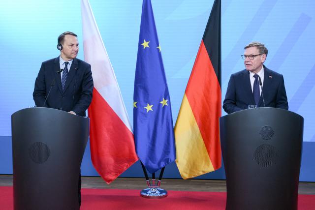 German Foreign Minister Johann Wadephul (R) and Polish Foreign Minister Radoslaw Sikorski address a joint press conference on the sidelines of the German-Polish Forum at the Foreign Ministry in Berlin on June 17, 2026. (Photo by RALF HIRSCHBERGER / AFP)