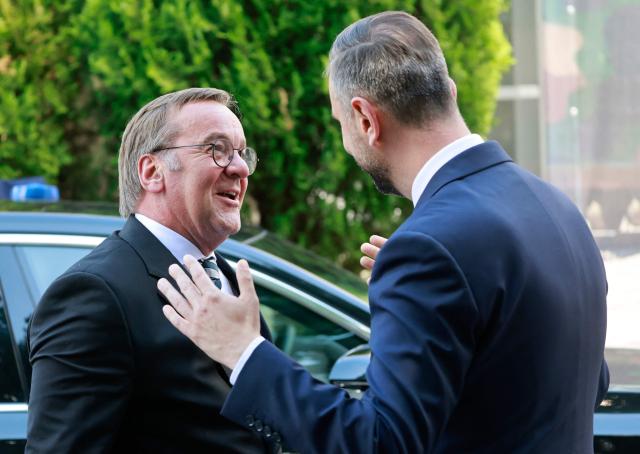 German Defence Minister Boris Pistorius (L) is welcomed by Poland's Deputy Prime Minister and Minister of National Defence Wladyslaw Kosiniak-Kamysz on June 17, 2026 in Warsaw, Poland. The two ministers are to sign a bilateral agreement on Polish-German defence cooperation. (Photo by Wojtek RADWANSKI / AFP)