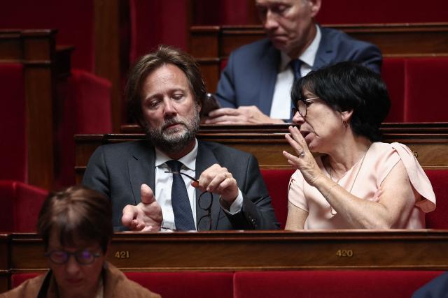 President of Socialistes et Apparentes parliamentary group Boris Vallaud (L) listens to Socialistes et Apparentes' MP Christine Pires Beaune during a session of questions to the government at The National Assembly, France's lower house of parliament in Paris on June 17, 2026. (Photo by Guillaume BAPTISTE / AFP)