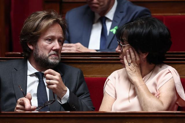 President of Socialistes et Apparentes parliamentary group Boris Vallaud (L) speaks with Socialistes et Apparentes' MP Christine Pires Beaune during a session of questions to the government at The National Assembly, France's lower house of parliament in Paris on June 17, 2026. (Photo by Guillaume BAPTISTE / AFP)