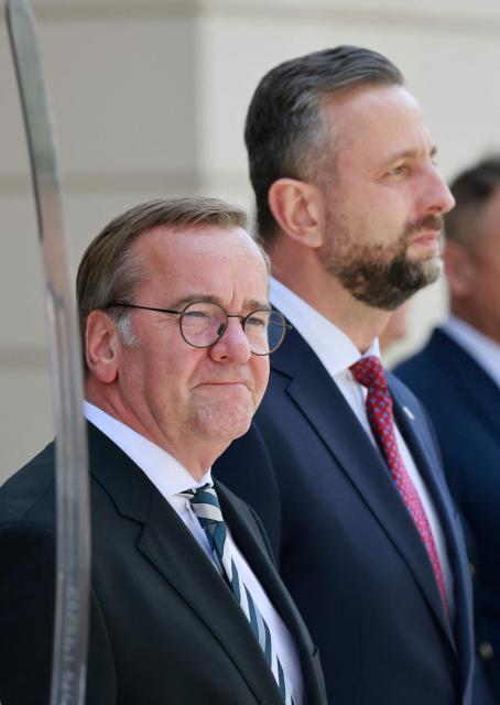 German Defence Minister Boris Pistorius (L) and Poland's Deputy Prime Minister and Minister of National Defence Wladyslaw Kosiniak-Kamysz review a military honor guard on June 17, 2026 in Warsaw, Poland. The two ministers are to sign a bilateral agreement on Polish-German defence cooperation. (Photo by Wojtek RADWANSKI / AFP)