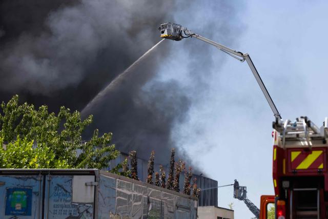 Firefighters work to extinguish a fire at an industrial facility in Bobigny, north of Paris, on June 17, 2026. (Photo by JOEL SAGET / AFP)