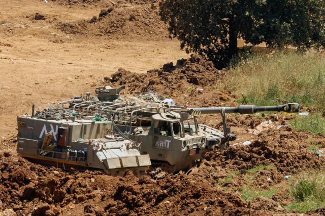 This picture taken from a position in the Upper Galilee in northern Israel, near the Israel-Lebanon border, shows Israeli army vehicles positioned along the border on June 17, 2026. Lebanon and Israel have been holding direct talks in Washington since April, seeking to end the hostilities between Israel and Hezbollah and separate their conflict from the wider regional war. (Photo by JACK GUEZ / AFP)