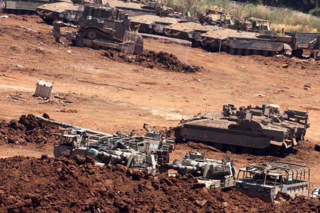 This picture taken from a position in the Upper Galilee in northern Israel, near the Israel-Lebanon border, shows Israeli army vehicles positioned along the border on June 17, 2026. Lebanon and Israel have been holding direct talks in Washington since April, seeking to end the hostilities between Israel and Hezbollah and separate their conflict from the wider regional war. (Photo by JACK GUEZ / AFP)