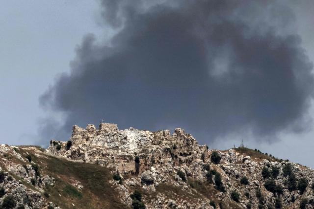 This picture taken from a position in the Upper Galilee in northern Israel, near the Israel-Lebanon border on June 17, 2026, shows smoke billowing in the distance behind the medieval Beaufort Castle in southern Lebanon, known locally as Qalaat al-Shaqif or Shaqif Arnoun, that was captured by Israeli forces last month. Lebanon and Israel have been holding direct talks in Washington since April, seeking to end the hostilities between Israel and Hezbollah and separate their conflict from the wider regional war. (Photo by JACK GUEZ / AFP)