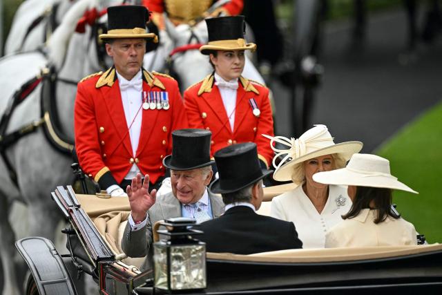 Britain's King Charles III (bottom L) and Britain's Queen Camilla (R) arrive on the second day of the Royal Ascot horse racing meeting in Ascot, west of London, on June 17, 2026. (Photo by JUSTIN TALLIS / AFP)