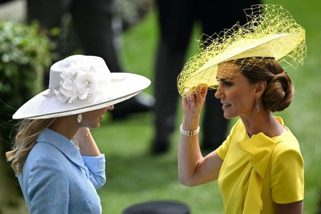 Britain's Catherine, Princess of Wales (R) chats on arrival on the second day of the Royal Ascot horse racing meeting in Ascot, west of London, on June 17, 2026. (Photo by JUSTIN TALLIS / AFP)