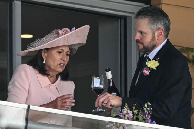 Carole Middleton (L), the mother of Britain's Catherine, Princess of Wales, has a drink at one of the boxes on the second day of the Royal Ascot horse racing meeting in Ascot, west of London, on June 17, 2026. (Photo by JUSTIN TALLIS / AFP)