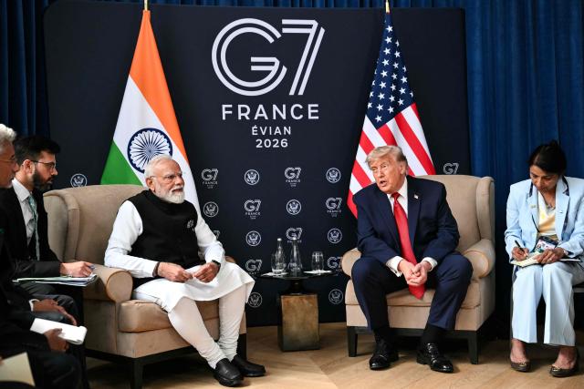 US President Donald Trump (2nd R) and India's Prime Minister Narendra Modi (3rd L) speak during a bilateral meeting as part of the G7 summit, in Evian, eastern France, on June 17, 2026. A G7 summit is set to take place June 15 to 17 in the French town of Evian-les-Bains near Switzerland and it will be attended by country leaders as well as the EU's foreign policy chief and ministers from Brazil, Canada, the United Arab Emirates and Turkey. (Photo by Mandel NGAN / AFP)