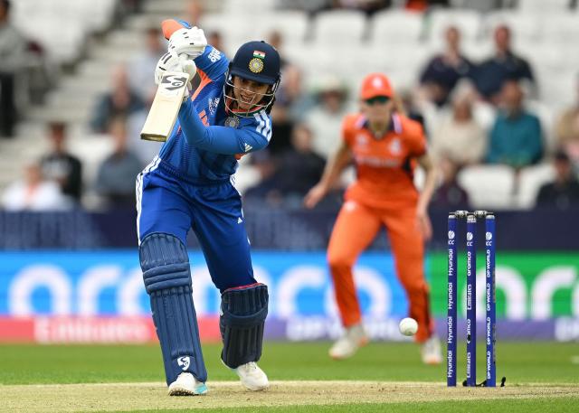 India's Smriti Mandhana (L) bats during the ICC Women's T20 cricket world cup 2026 game between India and The Netherlands, at Headingley in Leeds, northern England on June 17, 2026. (Photo by Oli SCARFF / AFP)