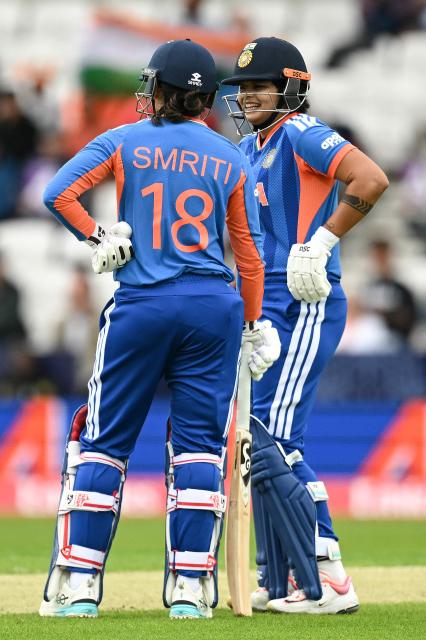 India's Smriti Mandhana (L) and India's Shafali Verma (R) chat between overs during the ICC Women's T20 cricket world cup 2026 game between India and The Netherlands, at Headingley in Leeds, northern England on June 17, 2026. (Photo by Oli SCARFF / AFP)