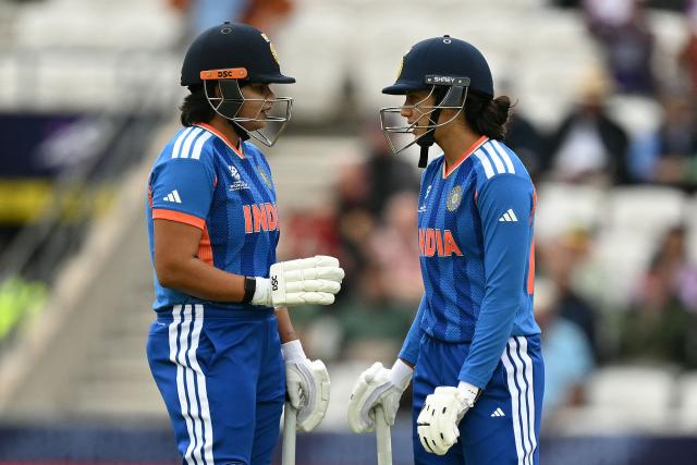 India's Shafali Verma (L) and India's Smriti Mandhana (R) chat between overs during the ICC Women's T20 cricket world cup 2026 game between India and The Netherlands, at Headingley in Leeds, northern England on June 17, 2026. (Photo by Oli SCARFF / AFP)