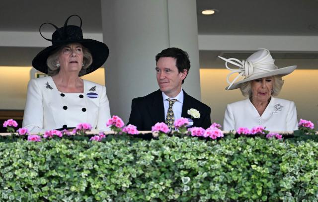 Fiona Mary Petty-Fitzmaurice (L), former Conservative MP Rory Stewart (C) and Britain's Queen Camilla stand in the Royal Box on the second day of the Royal Ascot horse racing meeting in Ascot, west of London, on June 17, 2026. (Photo by JUSTIN TALLIS / AFP)