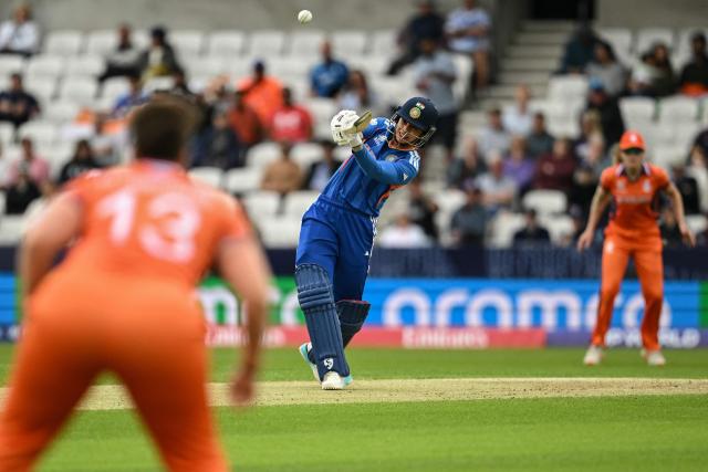 India's Smriti Mandhana (C) hits a four during the ICC Women's T20 cricket world cup 2026 game between India and The Netherlands, at Headingley in Leeds, northern England on June 17, 2026. (Photo by Oli SCARFF / AFP)