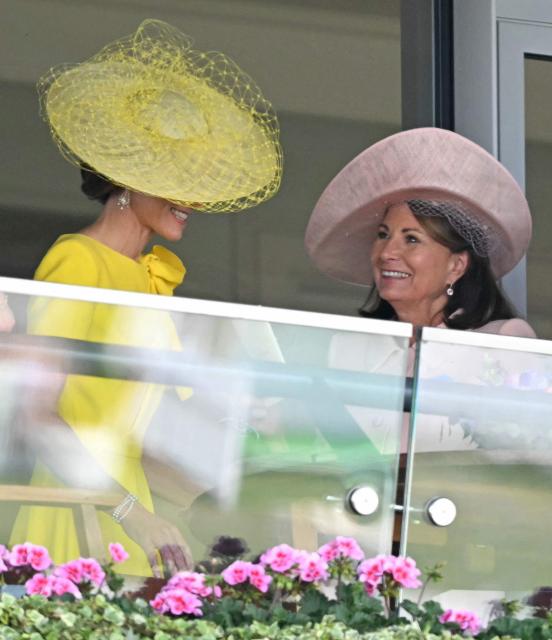 Britain's Catherine, Princess of Wales talks with her mother Carole Middleton on the second day of the Royal Ascot horse racing meeting in Ascot, west of London, on June 17, 2026. (Photo by JUSTIN TALLIS / AFP)
