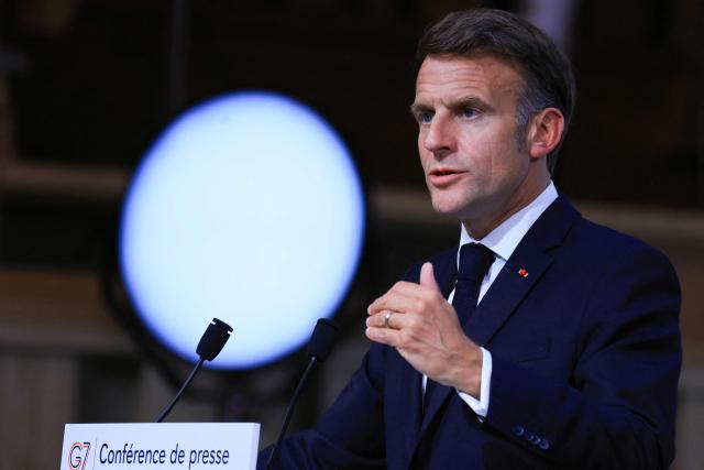 France's President Emmanuel Macron gestures as he speaks during the closing press conference of the G7 summit, in Evian, eastern France, on June 17, 2026. A G7 summit is set to take place June 15 to 17 in the French town of Evian-les-Bains near Switzerland and it will be attended by country leaders as well as the EU's foreign policy chief and ministers from Brazil, Canada, the United Arab Emirates and Turkey. (Photo by Ludovic MARIN / AFP)